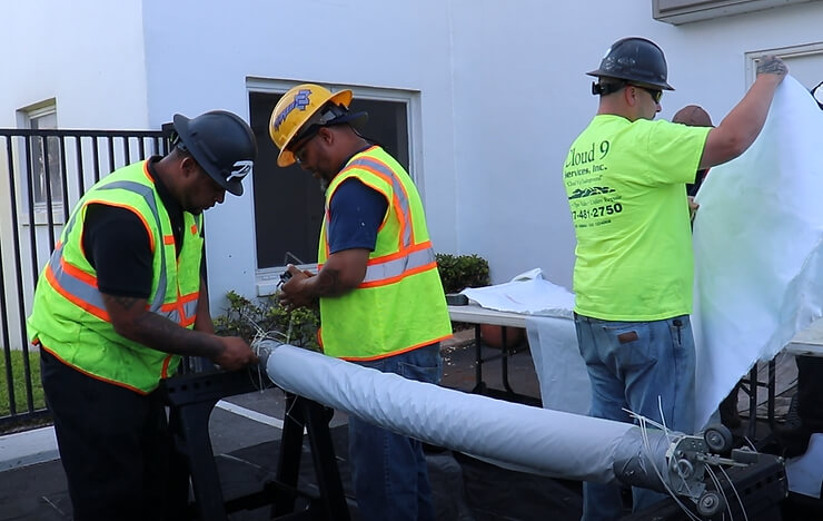 men working on a pipe