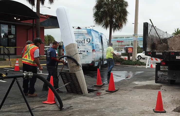 men working on a pipe